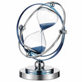 Dekorative Sanduhr mit Metallgestell und blauem Sand